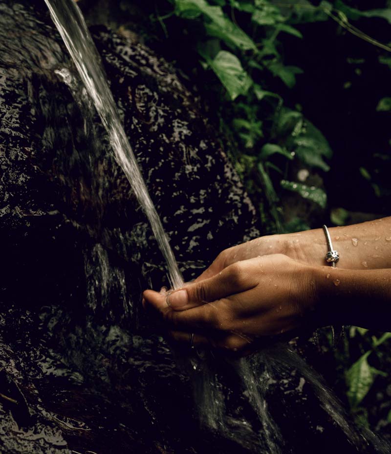 Close up of hands in a waterfall