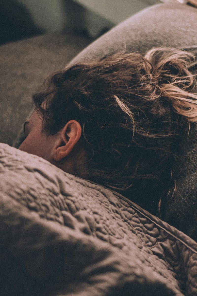Close up of lady sleeping, nice and cozy in bed